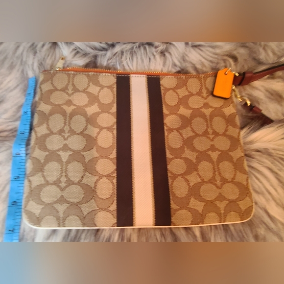 Coach Signature Leather Dempsey Tan and Orange Wristlet. - Picture 2 of 6